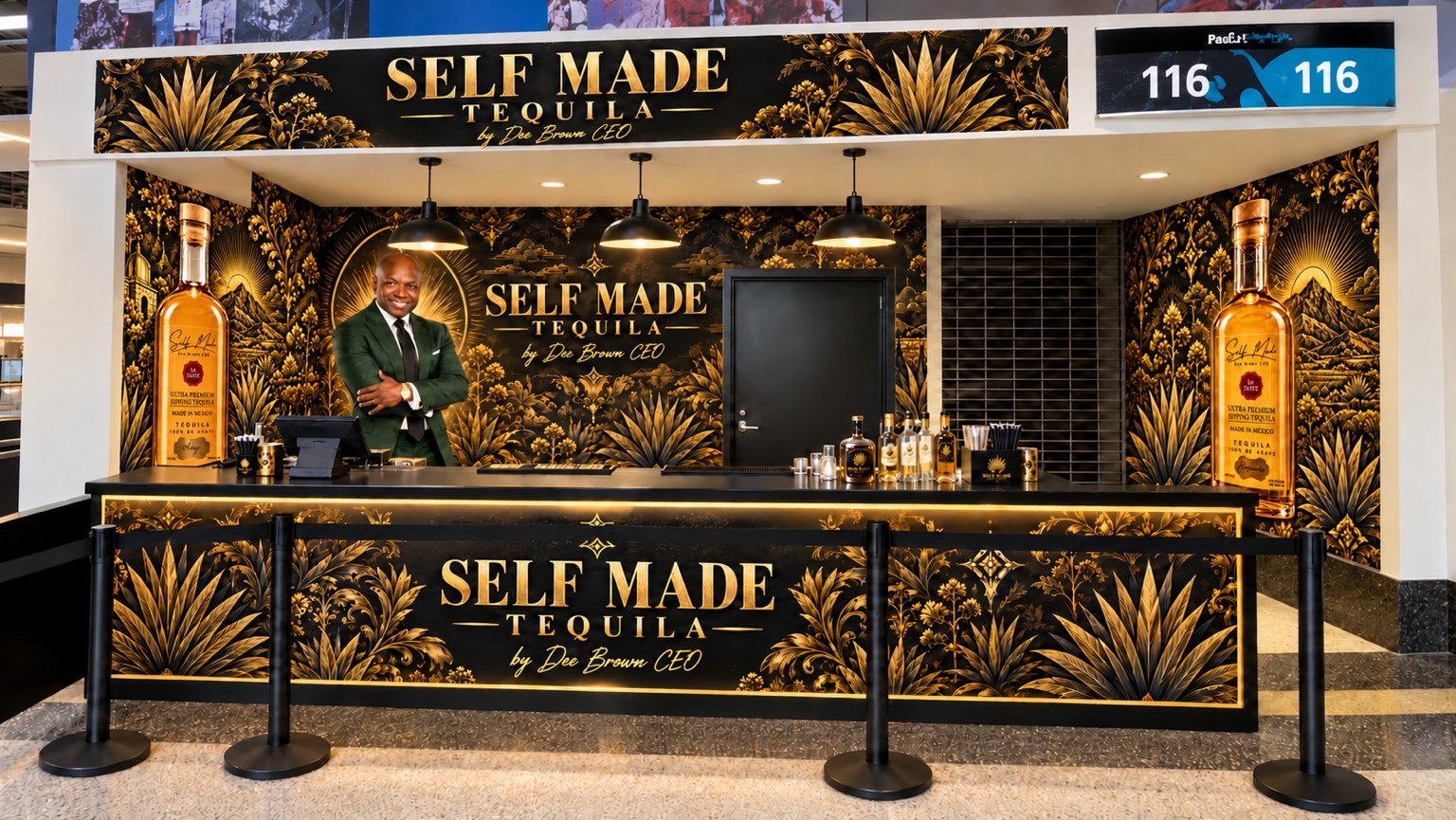 Self Made Tequila branded bar with black and gold agave artwork, bottle displays, and a portrait of Dee Brown